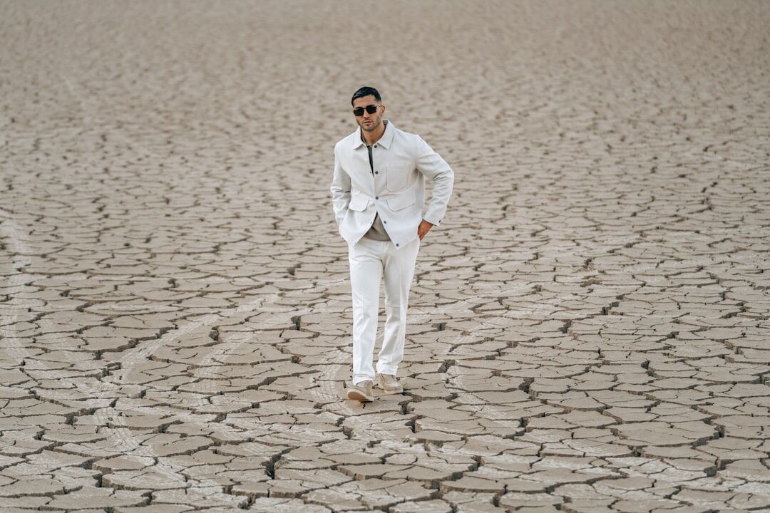farmer checking crops in drought